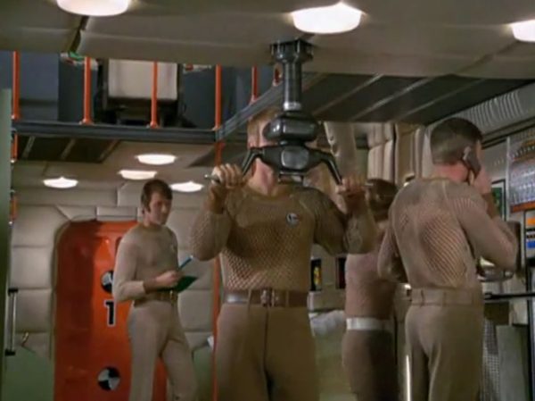 The Gay-Pride Fishnet Uniforms - The string-vest mesh and fishnet shirts worn by the male crew of the Skydiver submarine are a hilarious peak of 1970s fashion.
The Look - The male officers wore tight, completely see-through, sleeveless white fishnet string vests.
The "Sci-Fi" Excuse - The creators claimed the mesh holes allowed the skin to "breathe" in the sweaty, claustrophobic, high-tech environments of a submarine.
The Reality - It looked entirely like modern clubwear or pride festival gear. It was wildly liberal for 1970 network television to show straight male military officers casually walking around looking highly sexualized in see-through mesh.